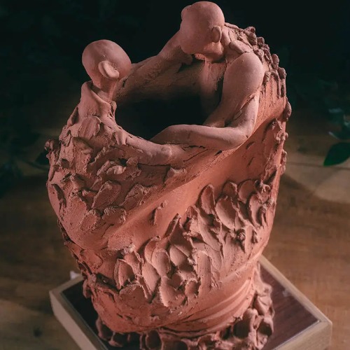 Man Holding Artistic Sculpture Décor